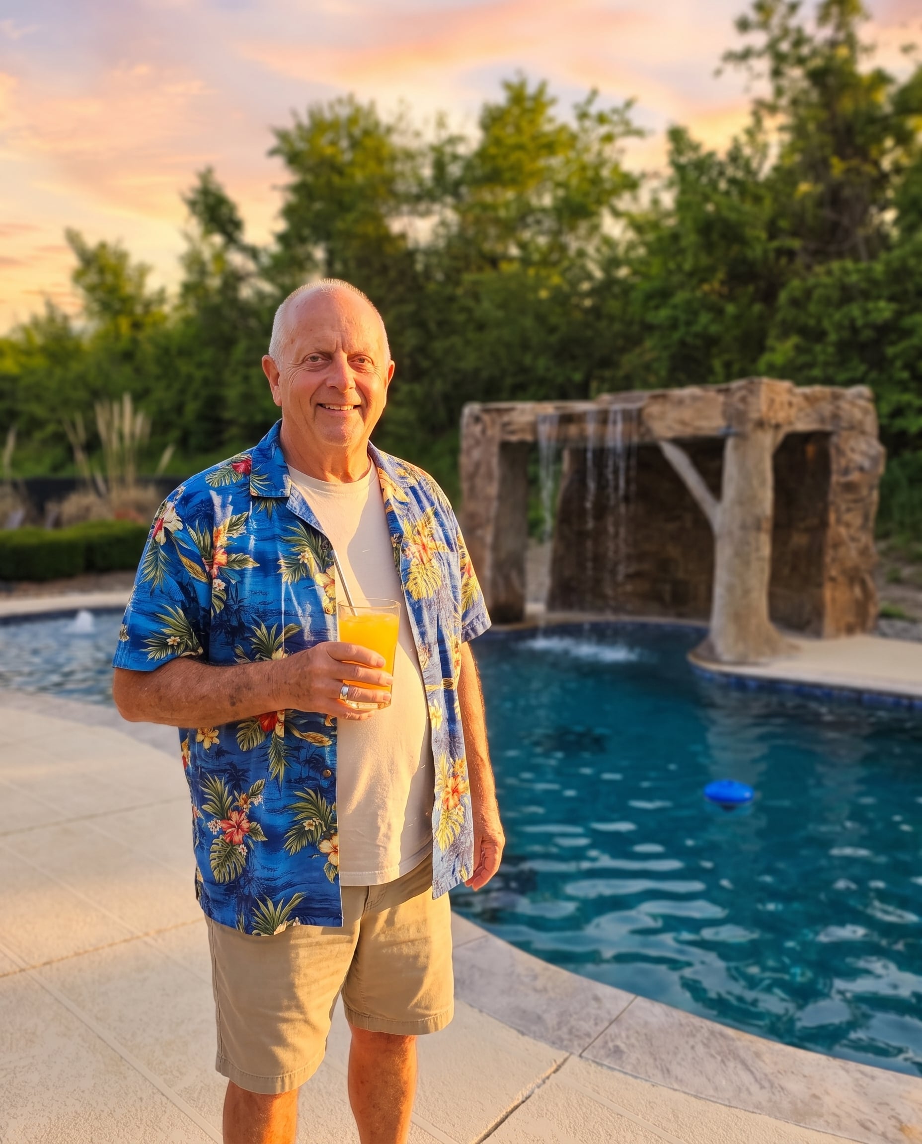 Ernie Nagy, the Pool Kahuna, beside a completed pool
