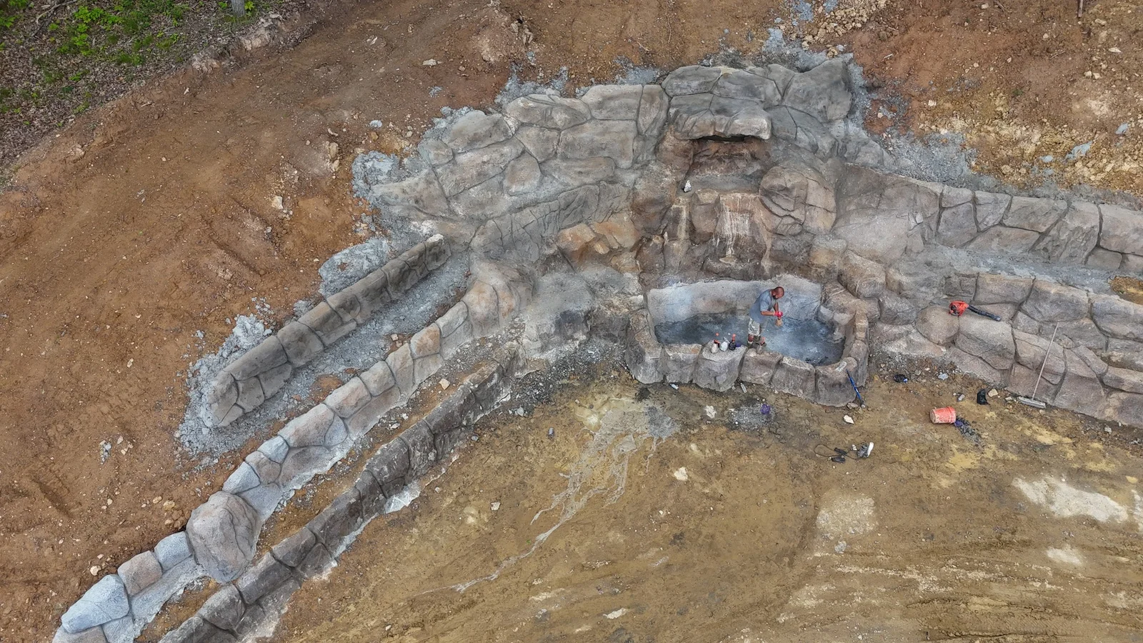 Aerial view of sculpted concrete rock waterfall and walls set into a Middle Tennessee hillside